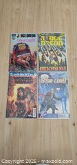 MaxSold Auction: Lot of 4 Comic Books  - Thorold (Ontario, Canada) SELLER MANAGED Downsizing Online Auction - Carleton Street North