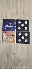 MaxSold Auction: Set of 2 Vintage E.T & Jerrassic Park Coin Sets - Thorold (Ontario, Canada) SELLER MANAGED Downsizing Online Auction - Carleton Street North