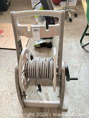 MaxSold Auction: Garden hose on wheeled reel with flexible metal-wrapped hose A - Ottawa (Ontario, Canada) PARTNER MANAGED Downsizing Online Auction - Sablewood Place