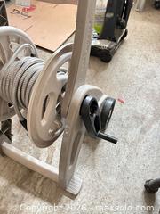 MaxSold Auction: Garden hose on wheeled reel with flexible metal-wrapped hose A - Ottawa (Ontario, Canada) PARTNER MANAGED Downsizing Online Auction - Sablewood Place