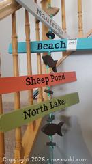 MaxSold Auction: Nautical Beach Directional Wall Hanging with Buoy A - Ottawa (Ontario, Canada) PARTNER MANAGED Downsizing Online Auction - Sablewood Place