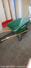MaxSold Auction: True Temper Wheelbarrow Garden Barrow — Plastic Tub, Wood Handles - Ottawa (Ontario, Canada) PARTNER MANAGED Downsizing Online Auction - Sablewood Place