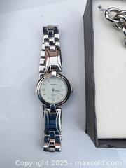 MaxSold Auction: Geneva Ladies Silver-Tone Quartz Watch with Charm Bracelet - Decatur (Georgia, USA) SELLER MANAGED Moving Online Auction - Snapfinger Woods Drive (STORAGE)