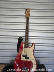 MaxSold Auction: Squier by fender bass guitar - Sun City (Arizona, USA) PARTNER MANAGED Downsizing Online Auction - North 107th Ave
