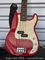 MaxSold Auction: Squier by fender bass guitar - Sun City (Arizona, USA) PARTNER MANAGED Downsizing Online Auction - North 107th Ave
