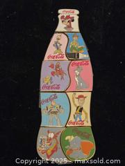MaxSold Auction: Unique disney coca cola bottle pin set - Sun City (Arizona, USA) PARTNER MANAGED Downsizing Online Auction - North 107th Avenue