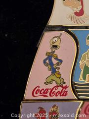 MaxSold Auction: Unique disney coca cola bottle pin set - Sun City (Arizona, USA) PARTNER MANAGED Downsizing Online Auction - North 107th Avenue