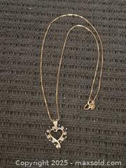 MaxSold Auction: Very pretty sterling heart necklace  - Sun City (Arizona, USA) PARTNER MANAGED Downsizing Online Auction - North 107th Avenue