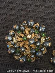MaxSold Auction: Vintage demario NY brooch and single earring - Sun City (Arizona, USA) PARTNER MANAGED Downsizing Online Auction - North 107th Ave
