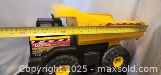 MaxSold Auction: Tonka Mighty Dump Truck 768 pressed Stee Yellow/ plastic black 1999 Vintage XMB-975 Wheels - Toronto (Ontario, Canada) SELLER MANAGED Reseller Online Auction - Falstaff Avenue (CONDO)