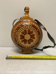 MaxSold Auction: Hand-Carved Wooden Folk Art Canteen with Leather Strap  - Vancouver (British Columbia, Canada) SELLER MANAGED Reseller Online Auction - East 7th Avenue (STORAGE)