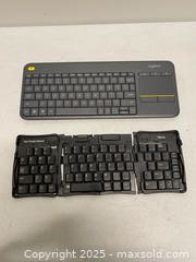 MaxSold Auction: Logitech K400 Plus Wireless Keyboard w/ Touchpad & Palm Portable Folding Keyboard – Mixed  - Vancouver (British Columbia, Canada) SELLER MANAGED Reseller Online Auction - East 7th Avenue (STORAGE)