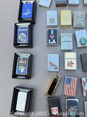 MaxSold Auction: Lot of Approximately 44 Zippo-Style Windproof Flip-Top Lighters - Los Angeles (California, USA) PARTNER MANAGED Downsizing Online Auction - W 88th Place