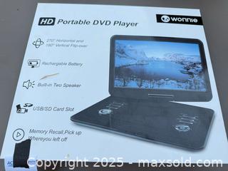 MaxSold Auction: Wonnle/Wonnie Portable Clamshell DVD Player - Los Angeles (California, USA) PARTNER MANAGED Downsizing Online Auction - West 88th Place