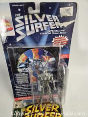 MaxSold Auction: Marvel The Silver Surfer Carded CD-ROM Figure with Comic - Toronto (Ontario, Canada) SHORT NOTICE PARTNER MANAGED Downsizing Online Auction - Research Road (STORAGE)