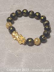 MaxSold Auction: Pixiu 999 Feng Shui Bracelet - Toronto (Ontario, Canada) SELLER MANAGED Downsizing Online Auction - Mcadam Avenue