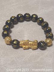 MaxSold Auction: Pixiu 999 Feng Shui Bracelet - Toronto (Ontario, Canada) SELLER MANAGED Downsizing Online Auction - Mcadam Avenue