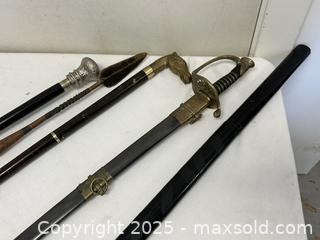 MaxSold Auction: Mixed Lot: Decorative Walking Canes, Saber-style Sword & Kitana - Livermore (California, USA) SELLER MANAGED Estate Sale Online Auction - Hansen Road
