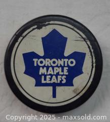 MaxSold Auction: 8x Hockey puck lot Toronto Maple Leafs and more - Toronto (Ontario, Canada) PARTNER MANAGED Reseller Online Auction - Queen Street West