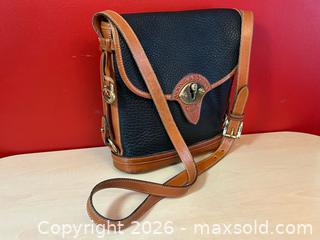 MaxSold Auction: Dooney & Bourke All-Weather Leather (AWL) Crossbody Bucket Purse – Navy & British Tan - London (Ontario, Canada) PARTNER MANAGED Downsizing Online Auction - Trillium Cres.