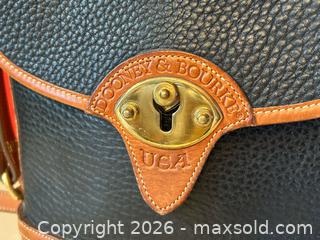MaxSold Auction: Dooney & Bourke All-Weather Leather (AWL) Crossbody Bucket Purse – Navy & British Tan - London (Ontario, Canada) PARTNER MANAGED Downsizing Online Auction - Trillium Cres.