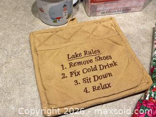 MaxSold Auction: Mixed Lot – Apron, Potholder, Mug, Candleholder & Puzzle Dictionary  - London (Ontario, Canada) PARTNER MANAGED Downsizing Online Auction - Trillium Crescent