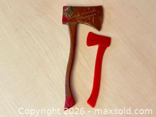 MaxSold Auction: Pair of Miniature Axes – Santa’s Village Souvenir & Red Plastic Toy - London (Ontario, Canada) PARTNER MANAGED Downsizing Online Auction - Trillium Crescent