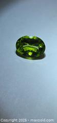 MaxSold Auction: Big beautiful vivid green Peridot  - Toronto (Ontario, Canada) PARTNER MANAGED Reseller Online Auction - Gerrard Street East (CONDO)