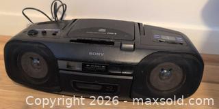 MaxSold Auction: Portable Stereo, Walkman and Vintage Tin B - London (Ontario, Canada) PARTNER MANAGED Downsizing Online Auction - Ford Crescent