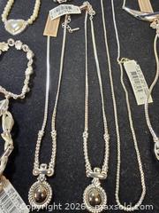MaxSold Auction: assortment of costume jewelry, primarily silver-tone necklaces, bracelets, and a pair of e - Toronto (Ontario, Canada) SELLER MANAGED Reseller Online Auction - Dartmoor Drive