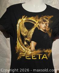 MaxSold Auction: Hunger Games t shirt  - Toronto (Ontario, Canada) SELLER MANAGED Commercial Liquidation Online Auction - Revlis Crescent