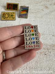 MaxSold Auction: Set of Four Vintage Stamp Pin Brooches - Kingston (Ontario, Canada) SELLER MANAGED Downsizing Online Auction - Bishop Street