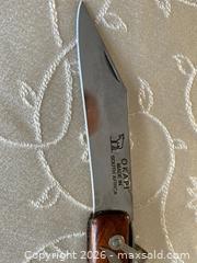 MaxSold Auction: Okapi South Africa Big Sable Folding Knife with a Cherry Wood Handle with Sheath. - Mississauga (Ontario, Canada) SELLER MANAGED Estate Sale Online Auction - Greenbower Court