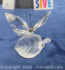 MaxSold Auction: Swarovski butterfly on leaf with box & papers  - Markham (Ontario, Canada) SELLER MANAGED Downsizing Online Auction - Loring Crescent