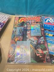 MaxSold Auction: 9 Robin 2 the jokers wild collectors sets, all unopened with contents  - Elgin (Ontario, Canada) SELLER MANAGED Downsizing Online Auction - Main Street