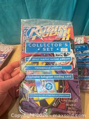 MaxSold Auction: 9 Robin 2 the jokers wild collectors sets, all unopened with contents  - Elgin (Ontario, Canada) SELLER MANAGED Downsizing Online Auction - Main Street