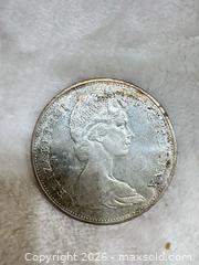 MaxSold Auction: 1965 Canada Silver Dollar Coin – Canoe Design (Elizabeth II)  - Toronto (Ontario, Canada) SELLER MANAGED Estate Sale Online Auction -Wellesley Street East