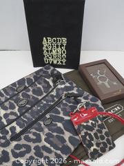 MaxSold Auction: Coach, Papyrus & Indigo lot: Leopard Print Lanyard, Keychain, Slipcover - Toronto (Ontario, Canada) PARTNER MANAGED Downsizing Online Auction - Research Road (STORAGE)
