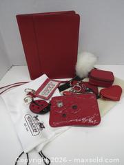 MaxSold Auction: COACH RED LEATHER & SIGNATURE CANVAS FOLIO - Toronto (Ontario, Canada) PARTNER MANAGED Downsizing Online Auction - Research Road (STORAGE)