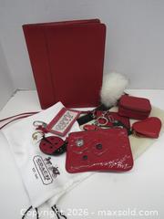 MaxSold Auction: COACH RED LEATHER & SIGNATURE CANVAS FOLIO - Toronto (Ontario, Canada) PARTNER MANAGED Downsizing Online Auction - Research Road (STORAGE)