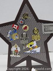 MaxSold Auction: Multicolor Enamel Pin Collection with Perforated Star Display - Toronto (Ontario, Canada) PARTNER MANAGED Downsizing Online Auction - Research Road (STORAGE)