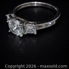 MaxSold Auction: Elegant Three-Stone Engagement Ring — Timeless Sophistication  - Newmarket (Ontario, Canada) SELLER MANAGED Downsizing Online Auction -  Brimson Drive (STORAGE)