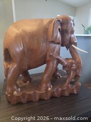 MaxSold Auction: Large teak wood carving of mother and her baby elephant. - Ottawa (Ontario, Canada) SELLER MANAGED Downsizing Online Auction - Seabrooke Drive