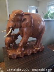 MaxSold Auction: Large teak wood carving of mother and her baby elephant. - Ottawa (Ontario, Canada) SELLER MANAGED Downsizing Online Auction - Seabrooke Drive