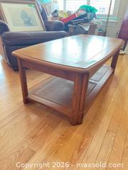 MaxSold Auction: Oak Coffee Table, Medium Brown, 46×24×17 in, Cane Lower Shelf - Kingston (Ontario, Canada) SELLER MANAGED Downsizing Online Auction - Langfield Street