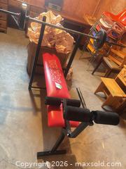 MaxSold Auction: Weider Red Home Weight Bench with Barbell Rack - Kingston (Ontario, Canada) SELLER MANAGED Downsizing Online Auction - Langfield Street