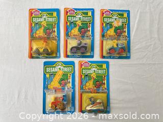 MaxSold Auction: Five vintage 1980s Sesame Street toys in original packaging - Vallejo (California, USA) SELLER MANAGED Estate Sale Online Auction - Georgia Street