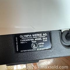 MaxSold Auction: Olympia Report de Luxe SKE Portable Electric Typewriter - Vancouver (British Columbia, Canada) SELLER MANAGED Downsizing Online Auction - Ortona Crescent