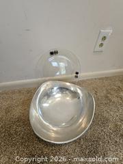 MaxSold Auction: Decorative Metal Bowl & Clear Acrylic Round Charger — 2-Piece Lot - Virginia Beach (Virginia, USA) SELLER MANAGED Downsizing Online Auction - Beachview Drive