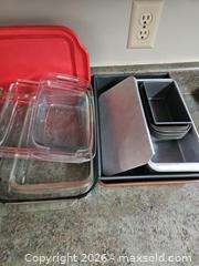 MaxSold Auction: Mixed bakeware & cookware lot - glass dishes, metal pans, silicone lids - Virginia Beach (Virginia, USA) SELLER MANAGED Downsizing Online Auction - Beachview Drive